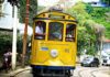 Yellow Cable Car on the cobblestone steets of Santa Teresa, Rio de Janeiro, Brazil.