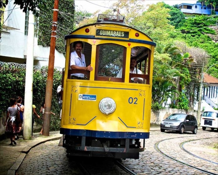 Santa-Teresa---Trolly Yellow Cable Car on the cobblestone steets of Santa Teresa, Rio de Janeiro, Brazil.