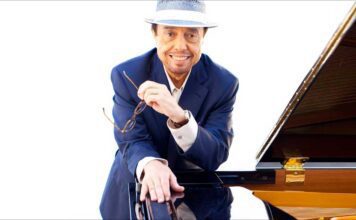 The Sounds of Brazil’s meet and greet with Sergio Mendes, pictured next to his grand piano.