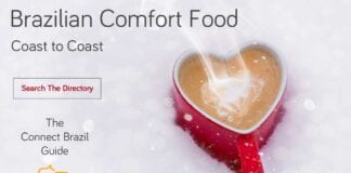 red heart-shaped coffe cup in snow