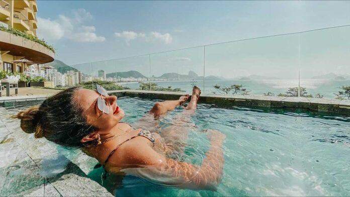 Female savoring Copacabana Rooftop Pool Crawl