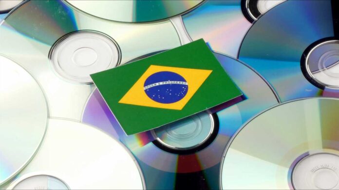 brazilian flag on top of silver cds