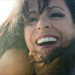 Brazilian singer Bebel Giberto smiles. Listen to the Women of Brazilian Song.
