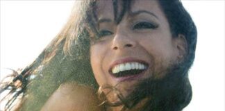 Brazilian singer Bebel Giberto smiles. Listen to the Women of Brazilian Song.