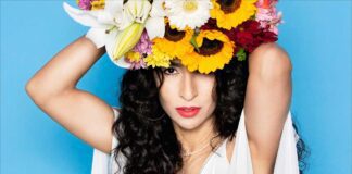 A New Song from Marisa Monte, pictured wearing sunflowers on her head.