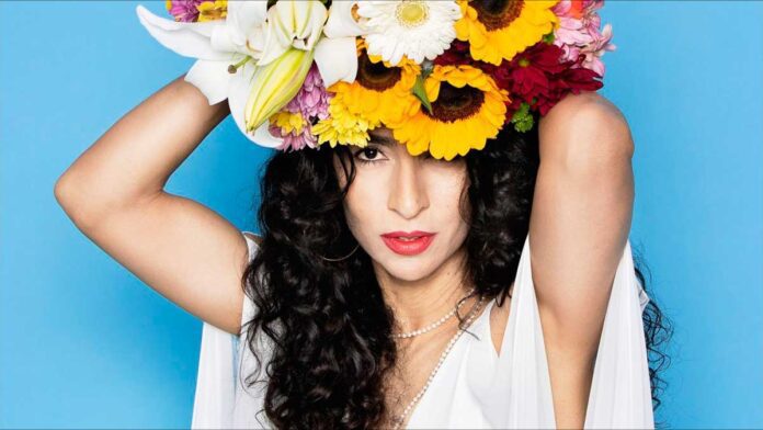 A New Song from Marisa Monte, pictured wearing sunflowers on her head.