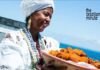 Baiana woman from Bahia holds a woven basket of Acaraje, African Culture in Brazil