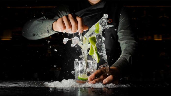 Bartender makingthe perfect caipirinha Brazilian cocktail.