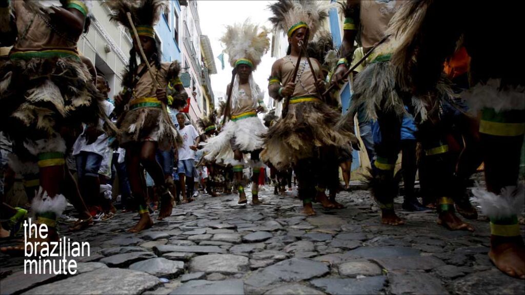 Celebrating Bahia's Independence Day as Indigenous people parade through the cobblestone streets of Salvador, Bahia.