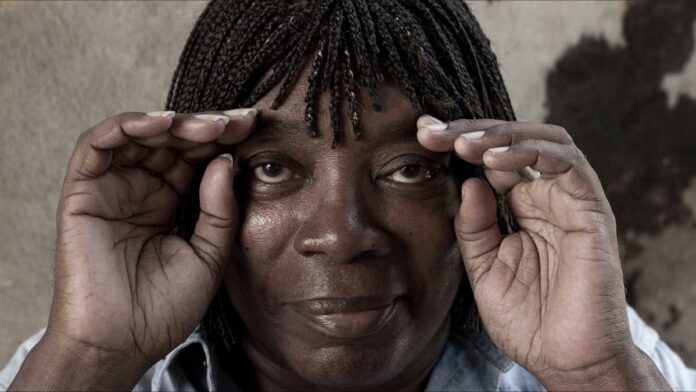 The Milton Nascimento Streaming Channel. Nascimento cups his hands around his eyes while smiling.