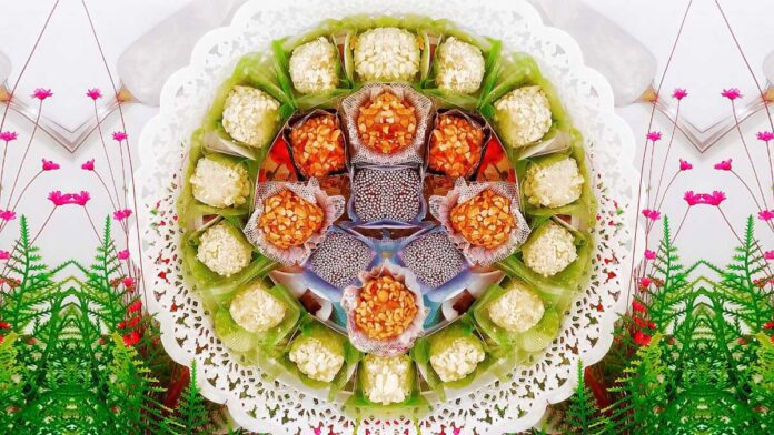 A colorful spring-like selection of Brazilian Brigadeiros decorate a white-laced desert platter.