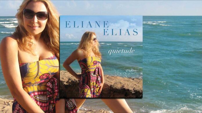 Eliane Elias’s Quietude Shares Personal Favorites . Brazilian jazz pianist and vocalist Eliane Elias Sits on stone wall near ocean