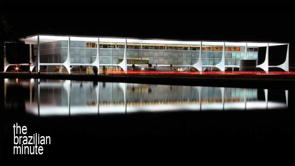 Understanding Brazilian Architect Oscar Niemeyer: Palacio do Planalto in Brasilia, illuminated at night near a reflecting pool.