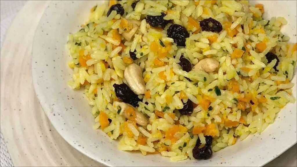 Explaining Brazils Christmas Traditions. Colorful Brazilian Christmas rice on a white dish