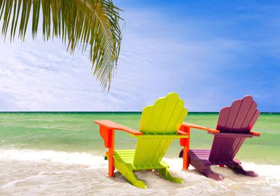 Relaxing Brazilian Music Streaming Channels. Bossa Nova Cover Songs. A pair of brightly-pianted beach chairs with a  sunny, seaside view.  