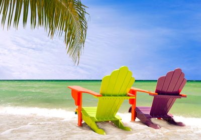 Relaxing Brazilian Music Streaming Channels. Bossa Nova Cover Songs. A pair of brightly-pianted beach chairs with a sunny, seaside view.