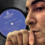 A World Without Bossa Nova? A world without Bossa Nova. Brazilian singer Joao Gilberto in profile with his debut record album in the background